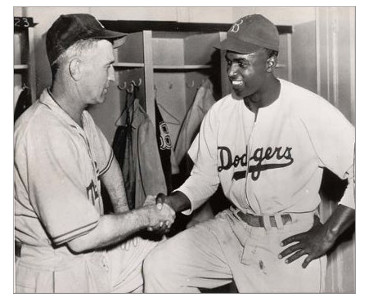 Clay Hopper, left, Montreal manager, congratulating Jackie Robinson.