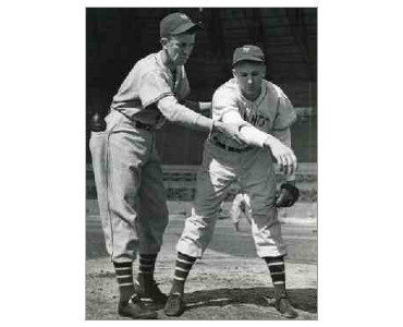 Hall of Famer, Carl Hubbell giving his brother, John Hubbell, a few pointers during a workout at the New York Giants spring training camp at Tropical Park, Havana, Cuba, February 1937.
